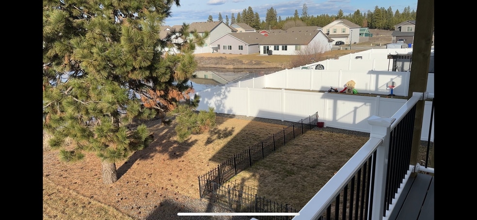 Backyard will have white fence like this when weather allows - 9016 W Winona Rd