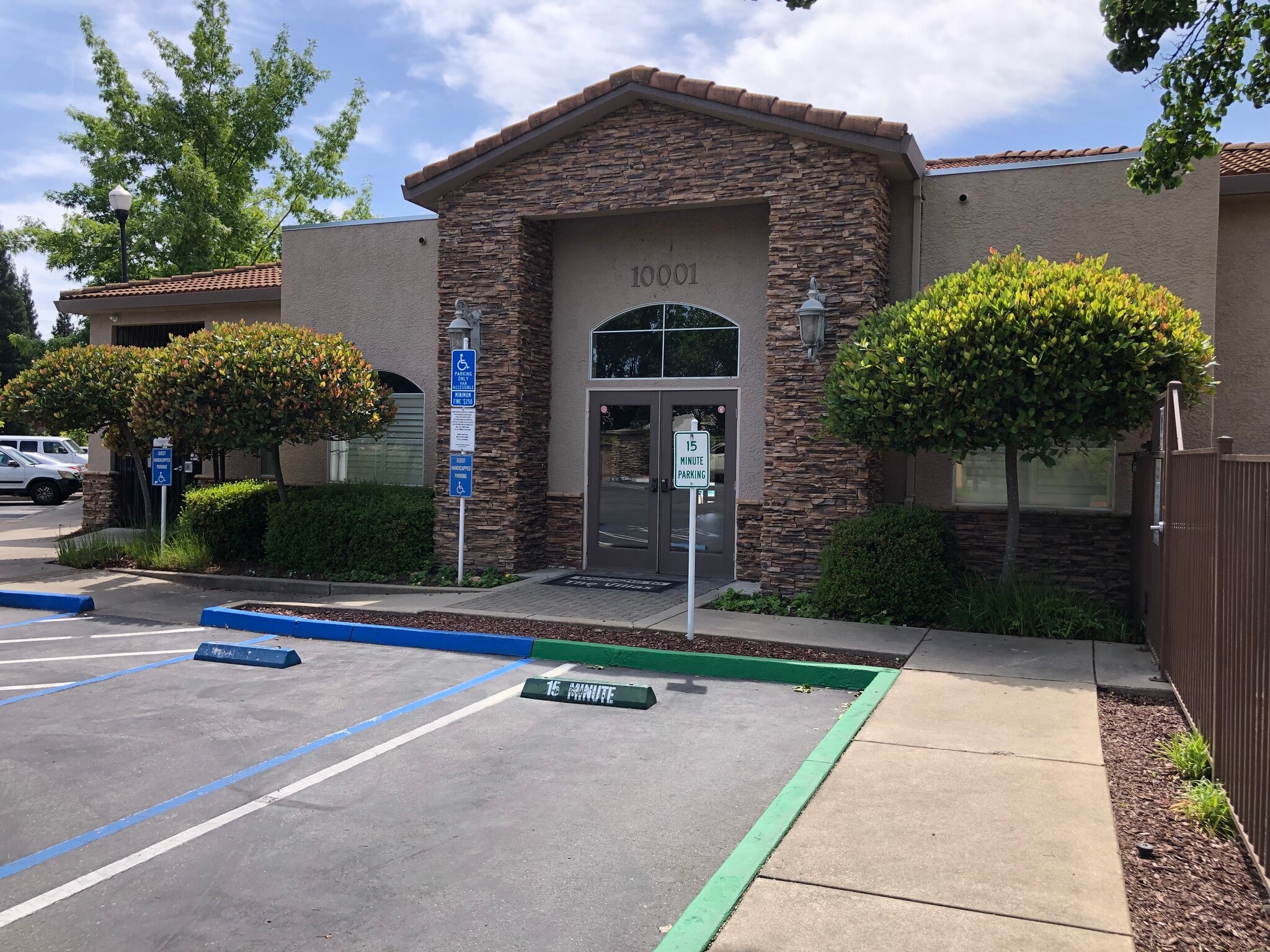 Property Club House at entrance. - 10001 Woodcreek Oaks Blvd