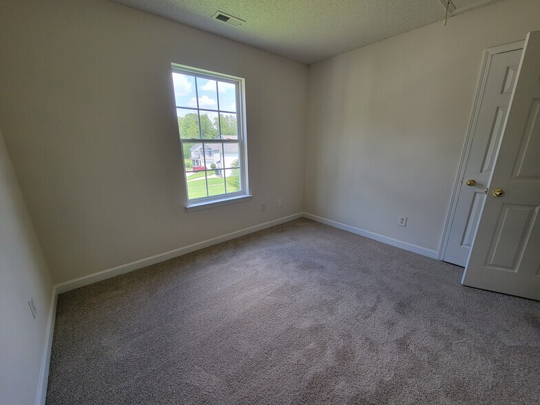 Bedroom #3 looks out onto the large backyard and would make a great, bright office space. - 6903 Seney Dr