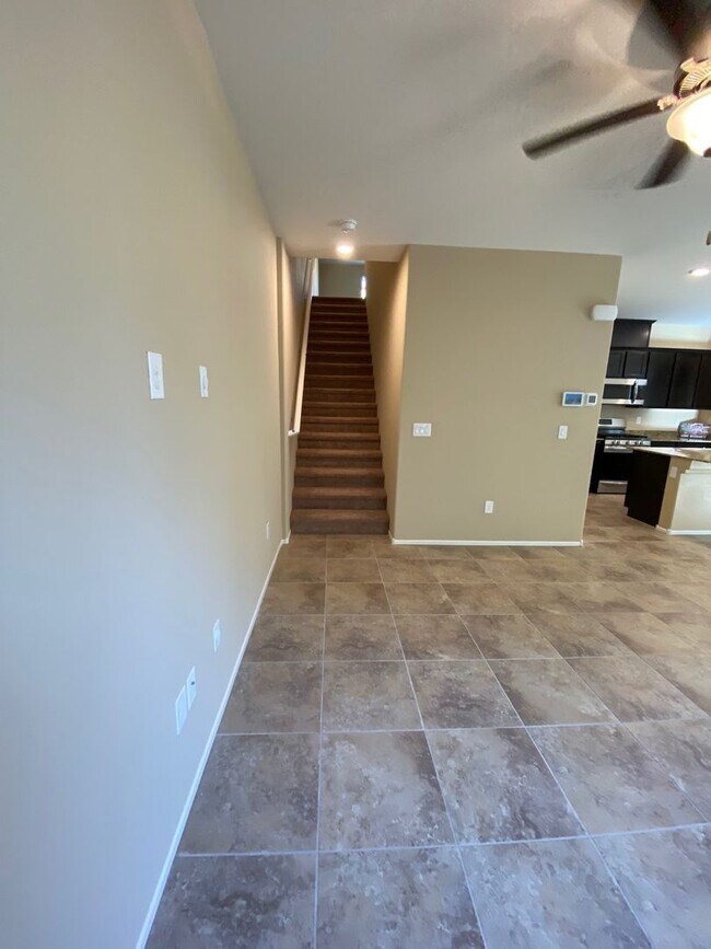 Building Photo - Spacious Townhouse with Loft & Rare 3-Car Garage!