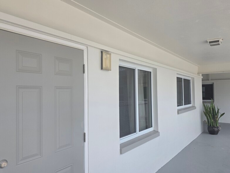front entrance with new hurricane windows and doors - 2590 First St