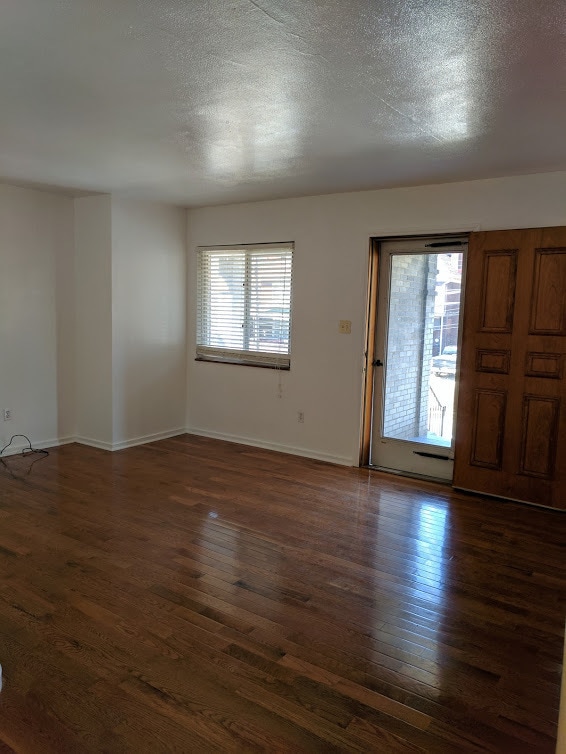 Building Photo - Check out this Totally Updated First Floor Duplex! 2BR+Den