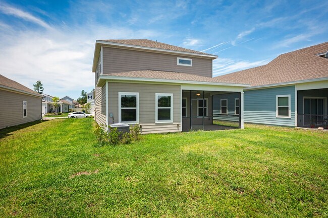 Building Photo - Spacious 4-Bedroom Home with Screened Pati...
