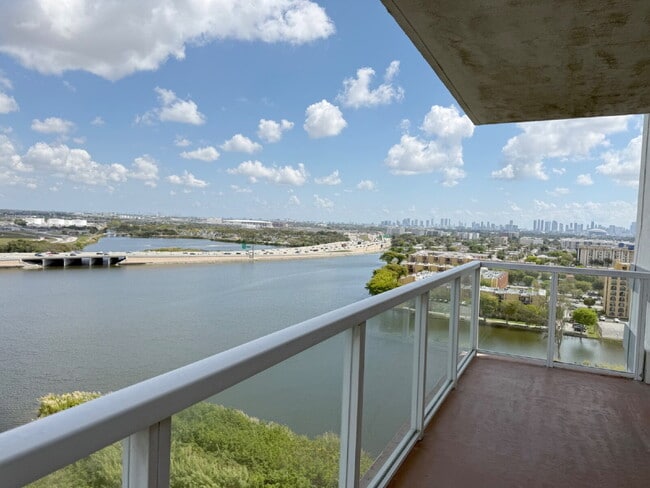 Building Photo - Rare 2/2 Corner Penthouse with Panoramic Lagoon Views from Every Room – Available Now!