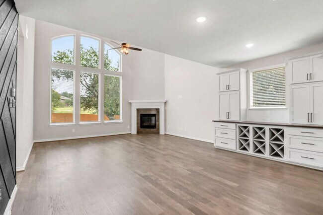 Building Photo - "Spacious 4-Bedroom Sanctuary with Cozy Fireplace in San Antonio's Prime Location!"
