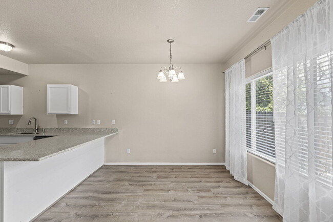 Building Photo - Updated 3-Bedroom Townhome with Private Ya...
