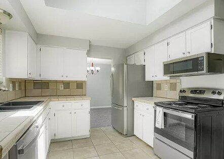 Kitchen with Skylight for incredible light and adjoins Dining Room - 18863 east milan