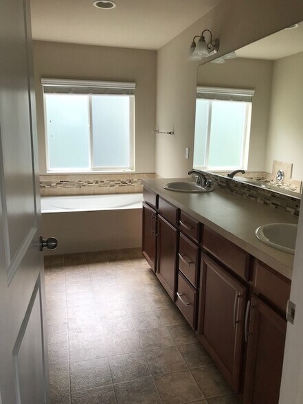 Master bath, separate lined on left. Tub & shower separate - 8828 Jayden Ln NE