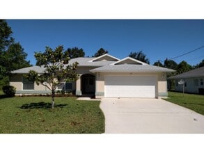 Building Photo - Updated 3/2/2 House in Palm Coast, FL.    www.WeRentSunshine.com