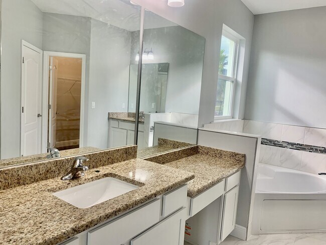 Building Photo - "Spacious 4-Bedroom 3-Bath with In-Law Suite & Granite Finishes in Palm Bay!"