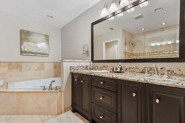Primary bath double vanity and Jacuzzi tub - 2535 NW 41st St