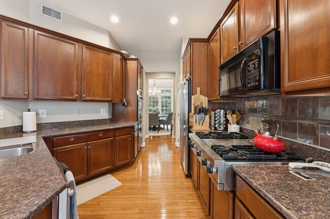 Building Photo - Discover this stunning four-level townhous...