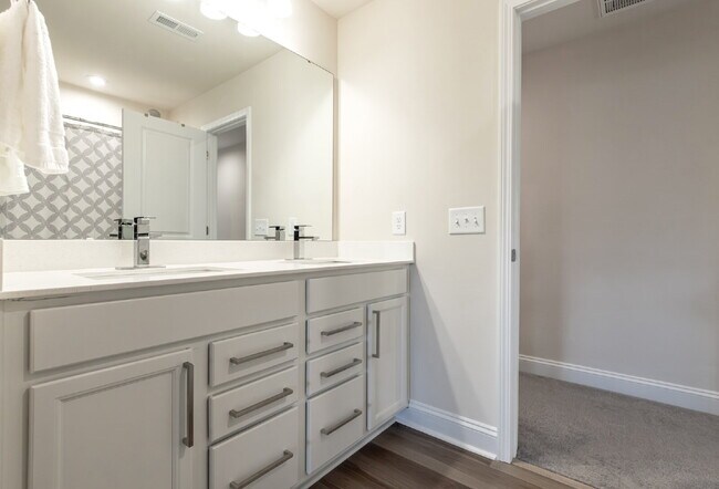 Building Photo - "Discover Spacious Living: 5-Bedroom Craftsman Home in Gated and Amenity-Rich Bretagne with Top-R...