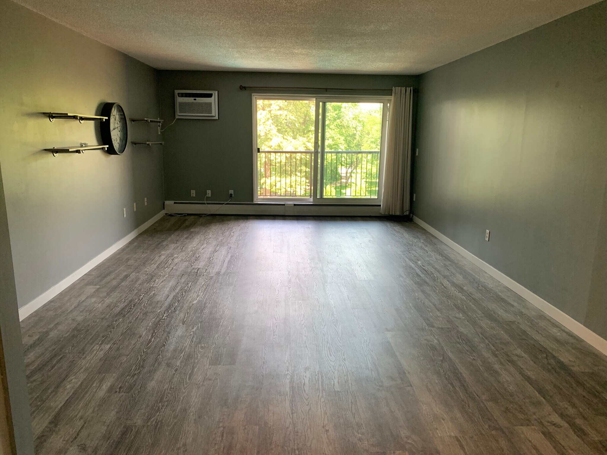 Open living space with LVP flooring - 4820 Park Commons Dr