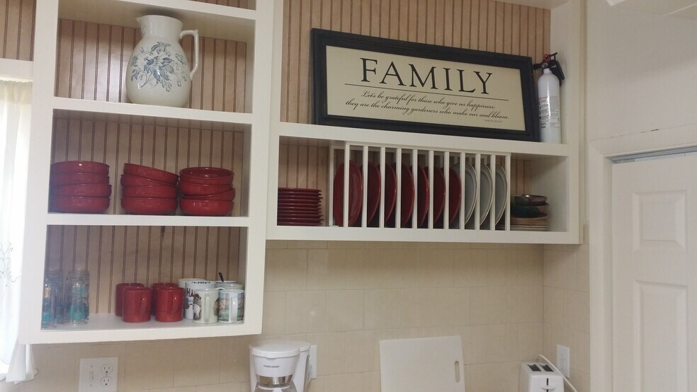 Kitchen includes built in plate holder (furnishings not included with rental) - 607 Harrison Ave