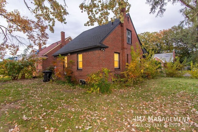 Building Photo - Welcome to this charming brick three-bedro...