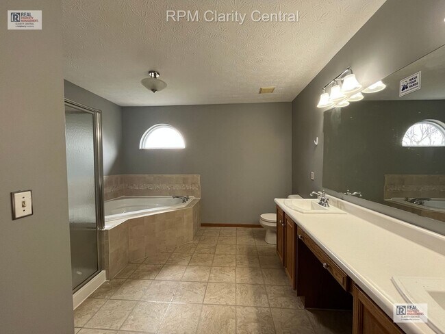 Building Photo - Spacious 4-Bedroom Home with Fenced Backyard, Deck, and 2-Car Garage