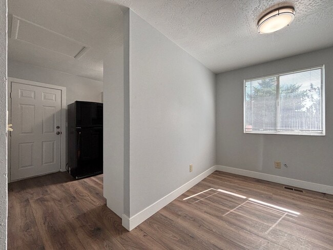 Building Photo - Cozy Home with New Paint & Flooring!