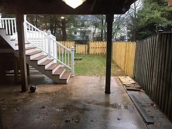 Building Photo - Spacious 3BR Townhome with Walkout Basement, Deck, Fenced Yard, Central A/C + Assigned Parking