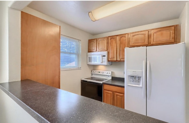 White microwave was replaced with a new black microwave - 4571 S Hannibal St