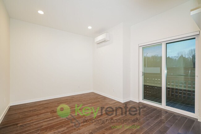 Building Photo - Rooftop Living with Open Concept Design and Parking Included