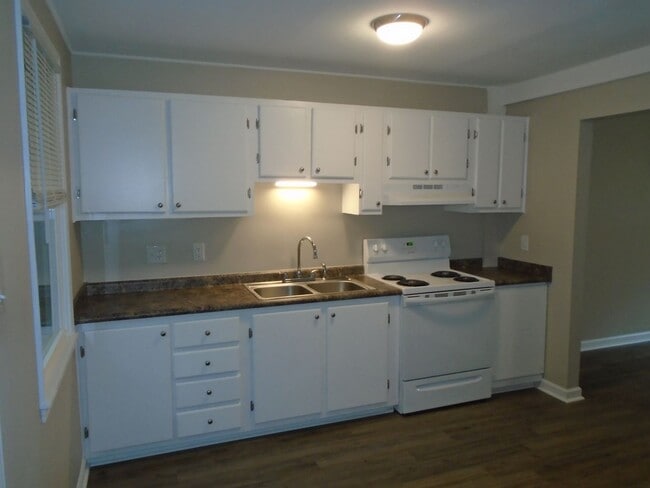 Building Photo - This two bedroom one bath duplex is centrally located. Just minutes to area bases, beaches, shopp...
