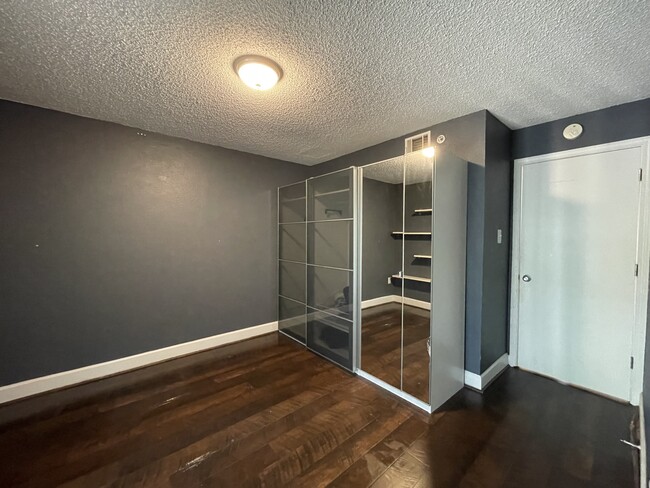 BEDROOM WITH BUILT IN STORAGE, SHELVING, WALKING CLOSET AND PRIVATE DECK. - 389 Ralph McGill Blvd NE