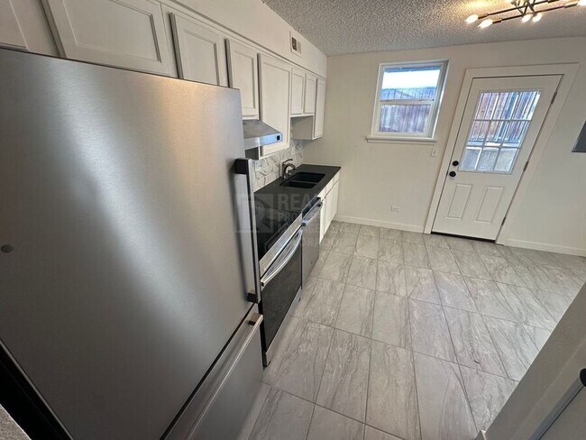 Building Photo - 9110 E Girard Ave