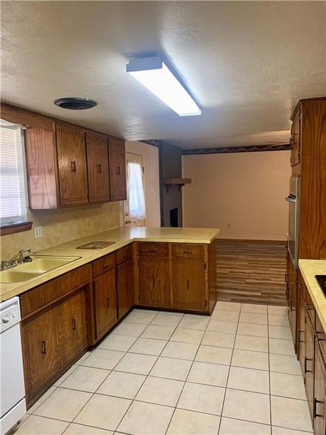 Building Photo - Charming Home with Open Kitchen, Fireplace & 2-Car Garage