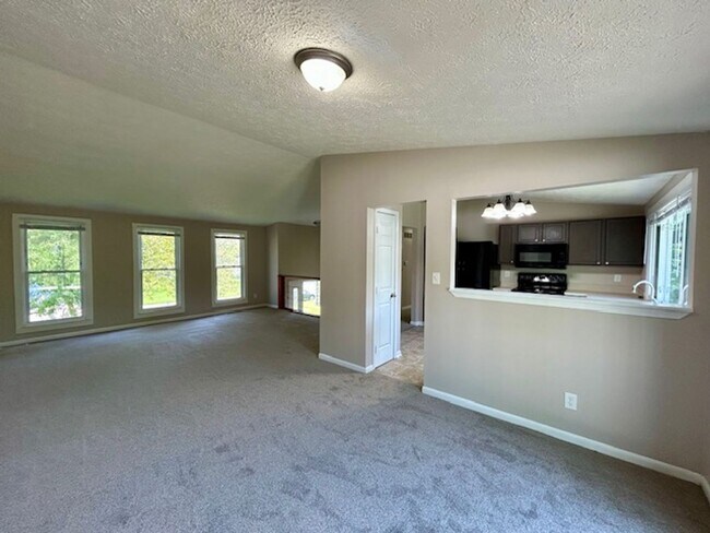 Building Photo - Welcome Home to This Beautifully Maintained Tri-Level Gem!