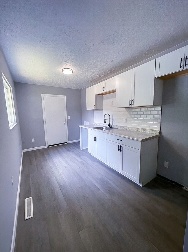 Building Photo - Charming 3-Bedroom Single-Family with New Kitchen, Large Yard & Off-Street Parking!