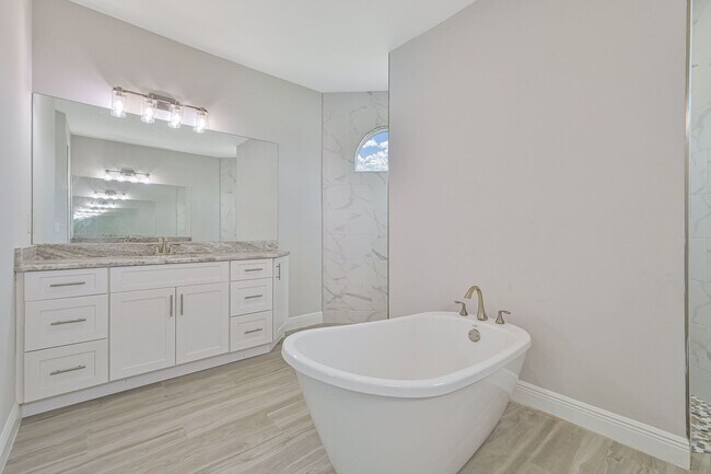 Building Photo - NOW AVAILABLE - Gorgeous Pool Home ~ NW Cape ~ 3 Car Garage ~ On Canal!