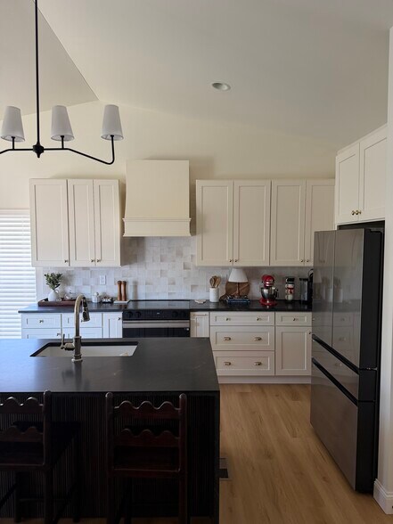 Kitchen with waterfall island - 4977 Knotty Alder Dr