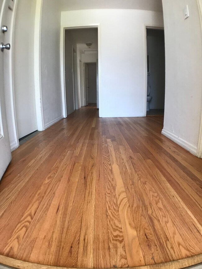 Building Photo - BEAUTIFUL WOOD FLOORS IN THIS- 5 BED 2 BATHROOM- Includes maid service