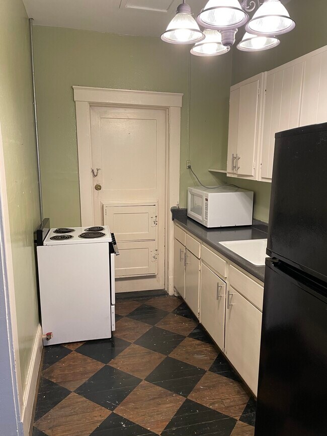 Kitchen angle 1 - 210 E State St