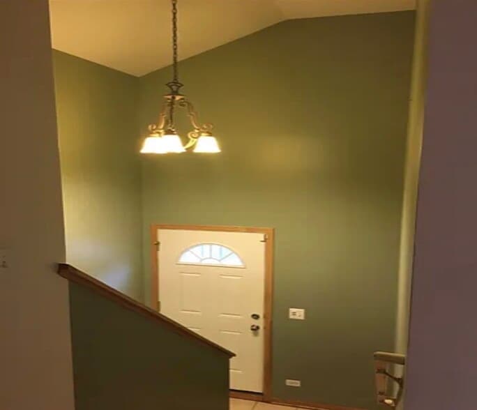 Landing with stairs to basement and also gated private patio - 419 W Root St