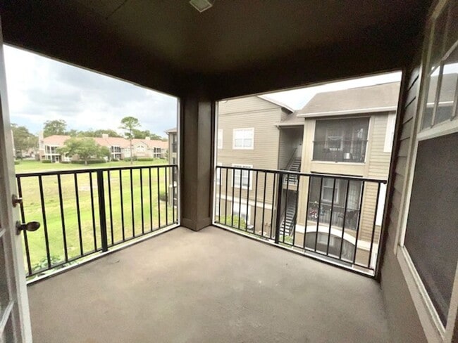 Building Photo - Move in NOW- Spacious 2 bedroom 1 bath condo on 3rd floor in gated community! Water included with...