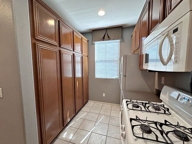 Building Photo - Spacious 3-Bedroom Home in Gated Community with Pool & Private Backyard