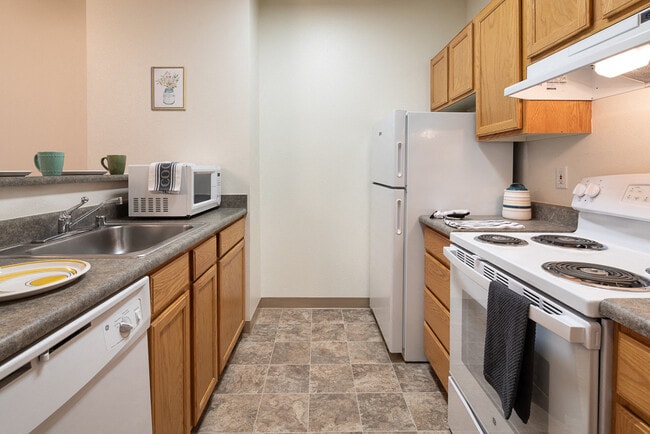 Dishwasher, Electric Stove and Range, Microwave and Refrigerator Appliances - Tate Mason House - 55+ Community