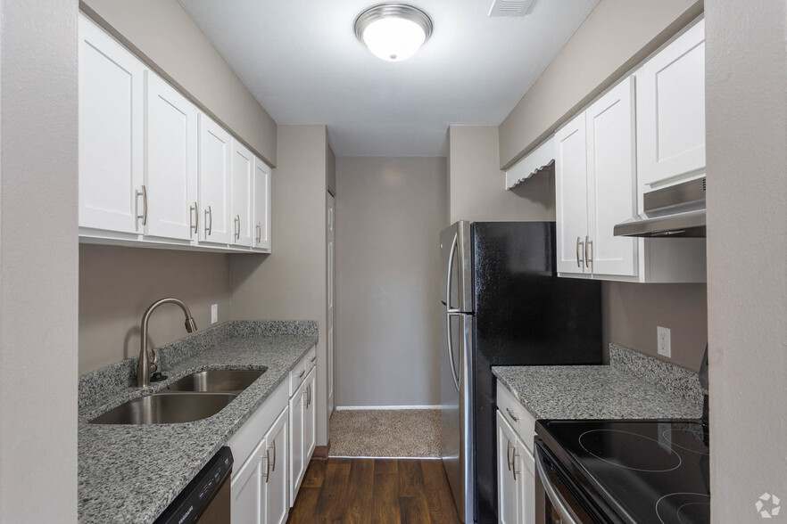 Galley-Style Kitchen With Stainless Appliances - Brighton Glens