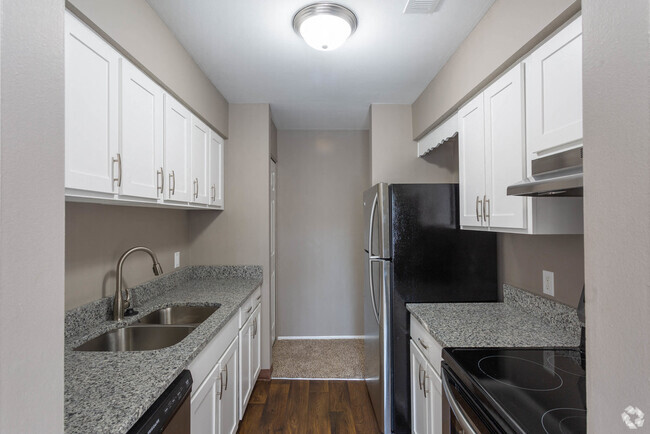 Galley-Style Kitchen With Stainless Appliances - Brighton Glens