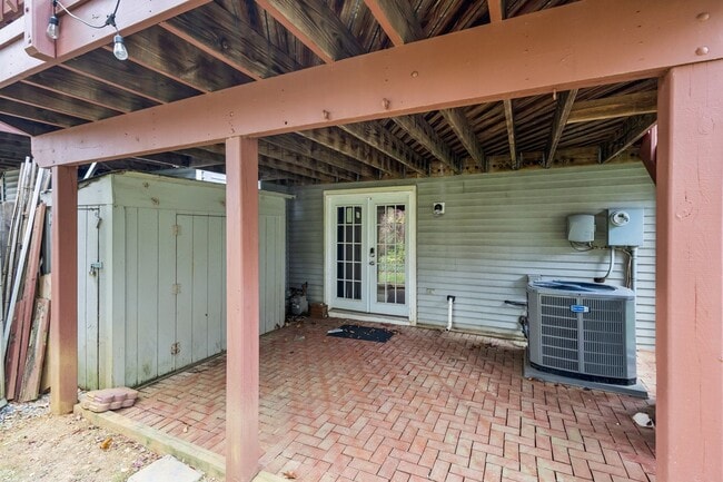 Building Photo - Modern Brick End-Unit Townhome with Stunning Upgrades and Serene Wooded Views