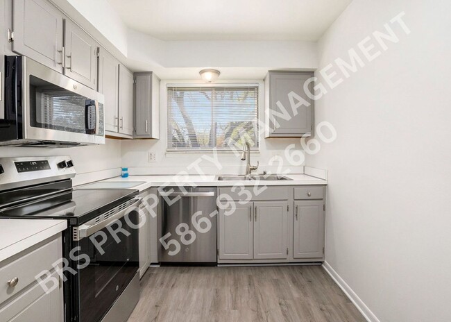 Building Photo - Charming 2-Bedroom Condo in Clinton Twp. –...