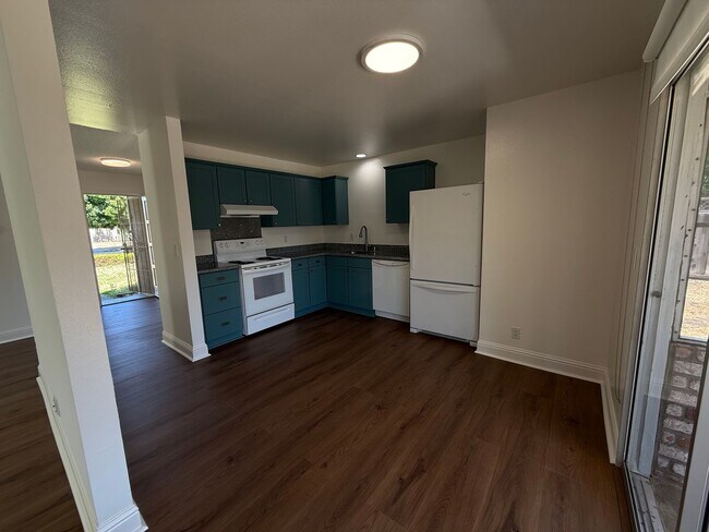 Building Photo - Recently updated home with new floors, paint & bathroom!