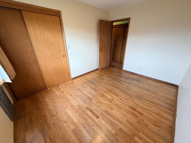 Building Photo - Country like setting! Spacious 3+ bed/ 1.5 bath house with garage, large yard, private deck and a...