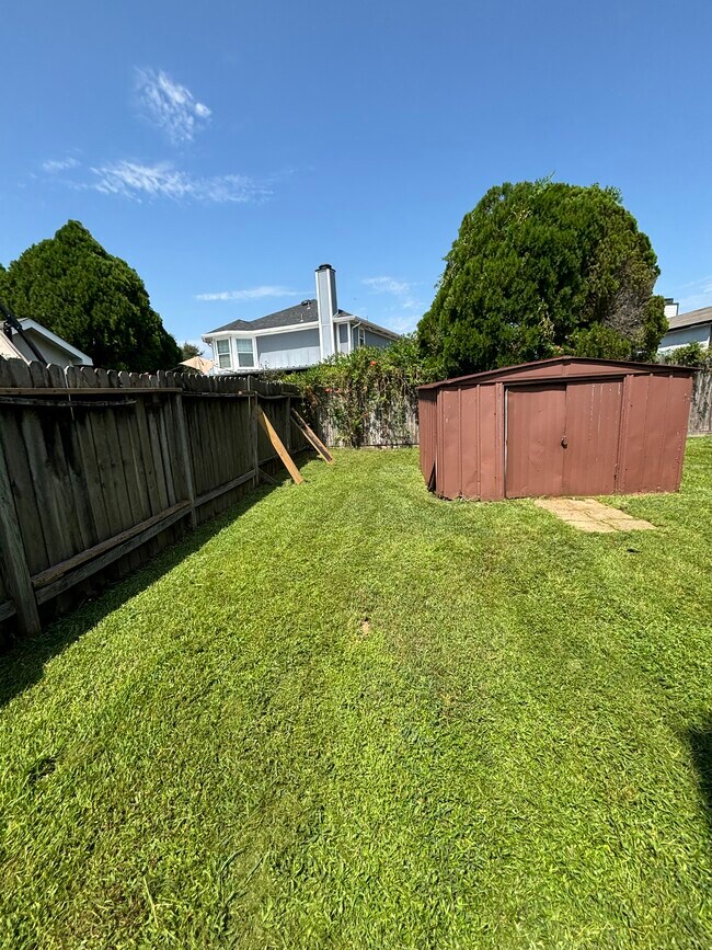 Side Backyard View 1 - 6319 Foxhunter Rd