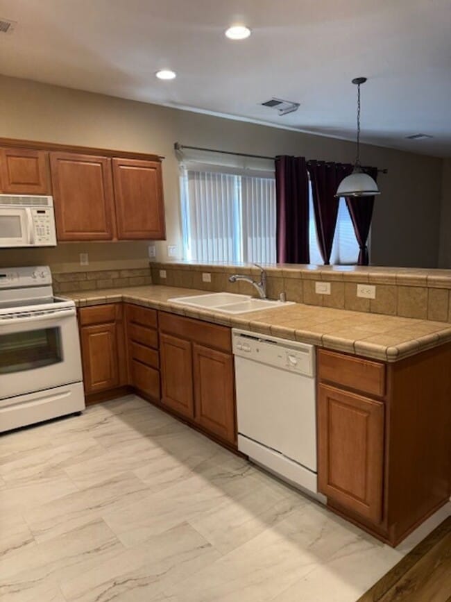 Building Photo - Located in a Quiet, Gated Community in Car...