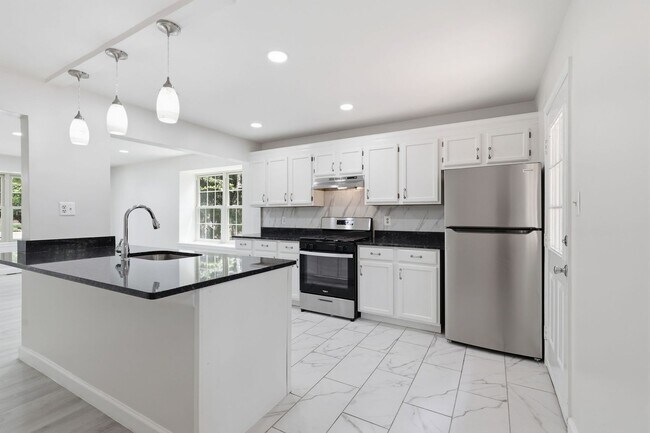 Building Photo - Experience contemporary living in this beautifully renovated residence where modern design meets ...