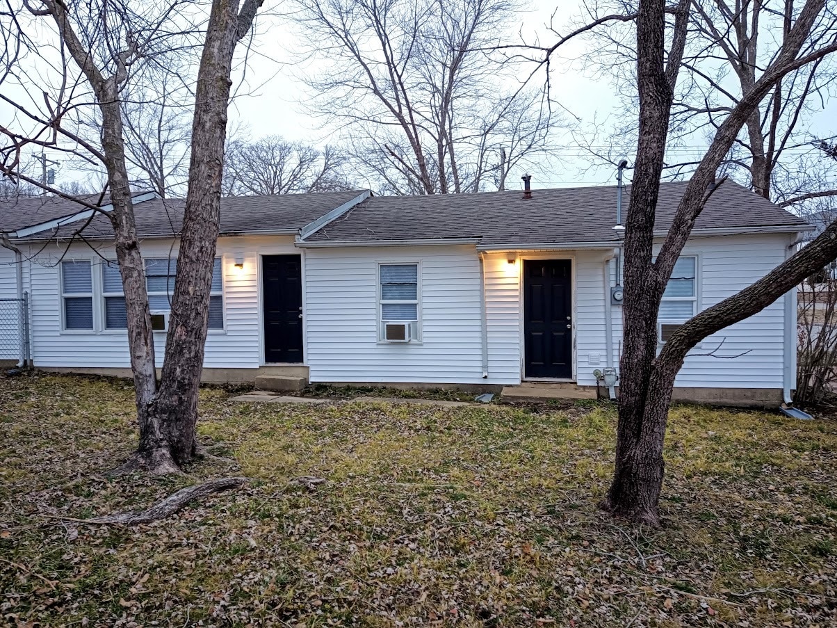 Backyard, the unit has two back doors, one from the dining/living room and one from the laundry room. - 303 Fleetwood Dr