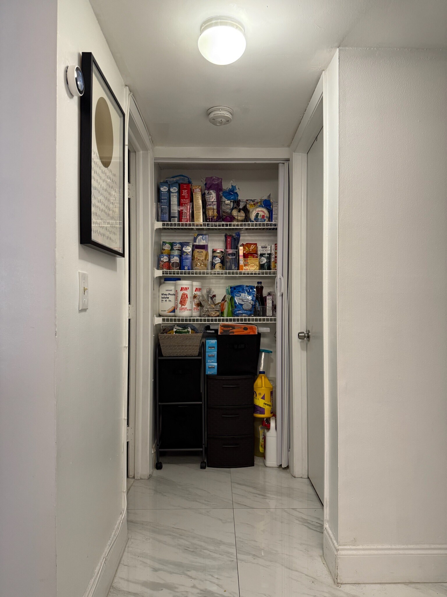 Pantry closet. Second bedroom (to the right) and second bathroom (to the left). - 2918 NE 8th Ter